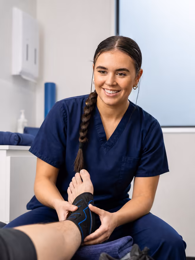Active Step clinician assessing a sports-related ankle injury in clinic
